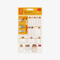 Adhesive labels and nametags with protective film in packaging on a grey background