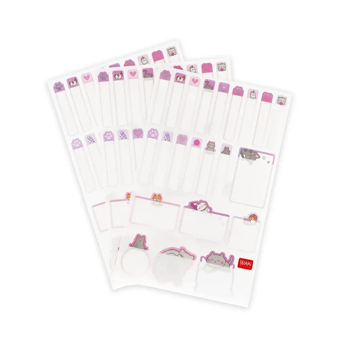 Set of stationery sheets with name tag stickers with cartoon cat designs on a white background