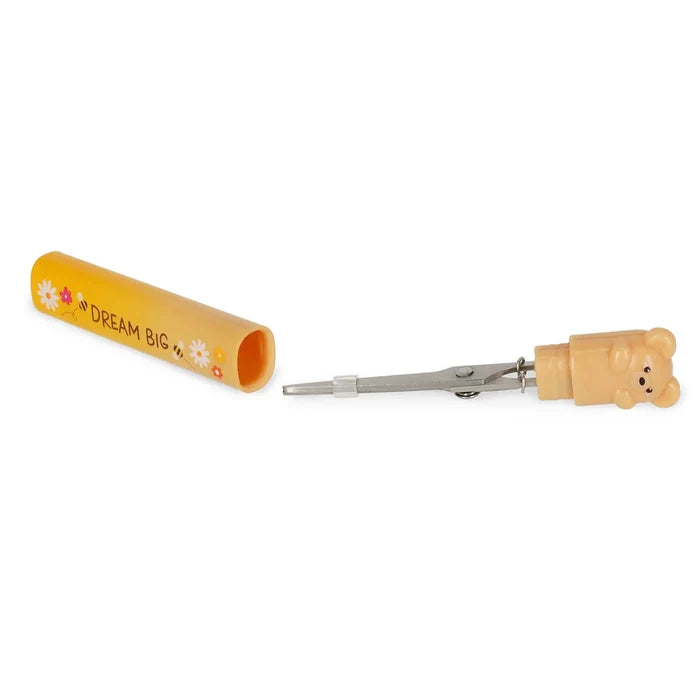Spring scissors with a yellow container labeled 'Dream Big' on a white background