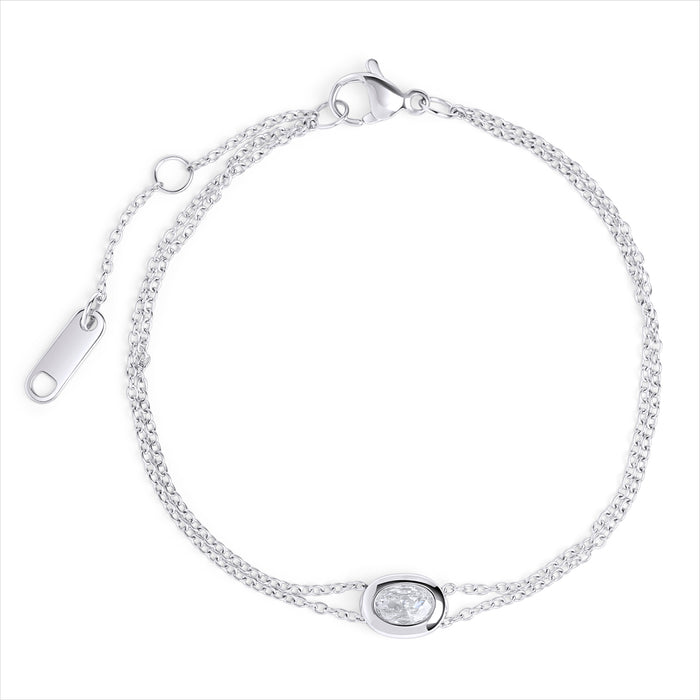 A double silver chain bracelet with an oval clear stone centerpiece, shown on a clean white background. Waterproof, stainless steel and allergy free. By Mia Bijoux Canada.

Bracelet à double chaîne argentée orné d'une pierre transparente ovale en son centre, présenté sur fond blanc épuré. Résistant à l'eau, en acier inoxydable et hypoallergénique. Par Mia Bijoux Canada.