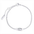 A double silver chain bracelet with an oval clear stone centerpiece, shown on a clean white background. Waterproof, stainless steel and allergy free. By Mia Bijoux Canada.

Bracelet à double chaîne argentée orné d'une pierre transparente ovale en son centre, présenté sur fond blanc épuré. Résistant à l'eau, en acier inoxydable et hypoallergénique. Par Mia Bijoux Canada.