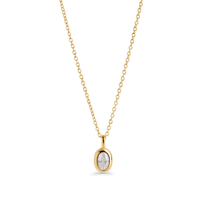 A gold chain necklace with a small oval clear stone pendant, shown on a clean white background. Waterproof, stainless steel and allergy free. By MIAJWL.

Collier à chaîne dorée avec petit pendentif serti d'une pierre transparente ovale, présenté sur fond blanc épuré. Résistant à l'eau, en acier inoxydable et hypoallergénique. Par MIAJWL.