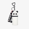 Panda-shaped keychain with a white pouch on a light pink background