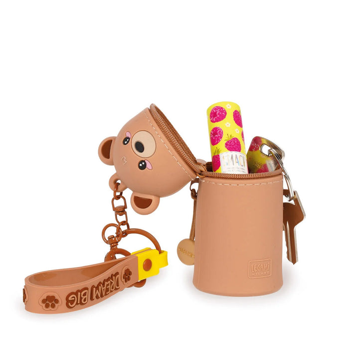 Brown monkey-shaped keychain with a pouch and strap on a white background