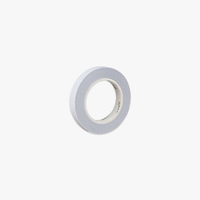 Roll of white doubleside tape on a white background
