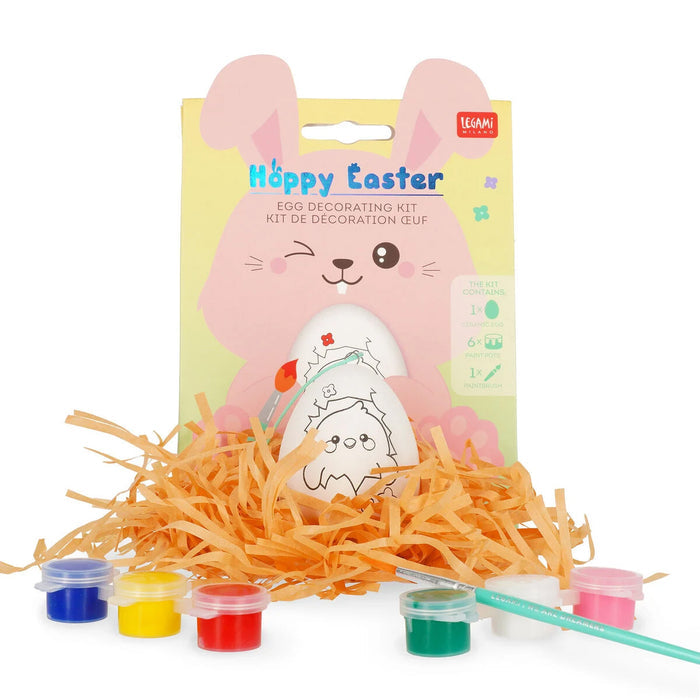 Easter egg decorating kit with paint containers and a bunny-shaped card on a white background