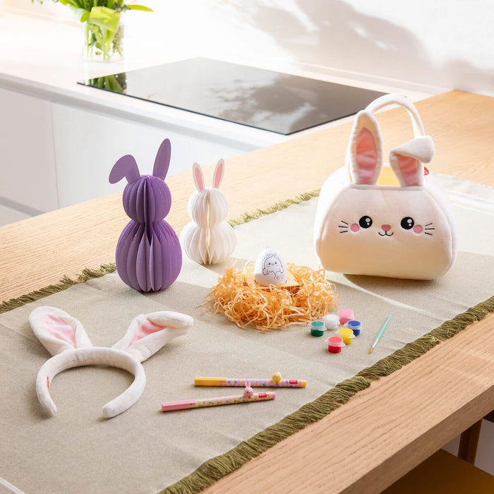 Set of rabbit-themed items including a small bag, headbands, and stationery from Legami Milano on a table.