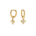 Twisted silver hoop earrings with gold flower charm in surgical stainless steel, hypoallergenic earrings for sensitive ears, lightweight, durable and tarnish resistant in Canada.