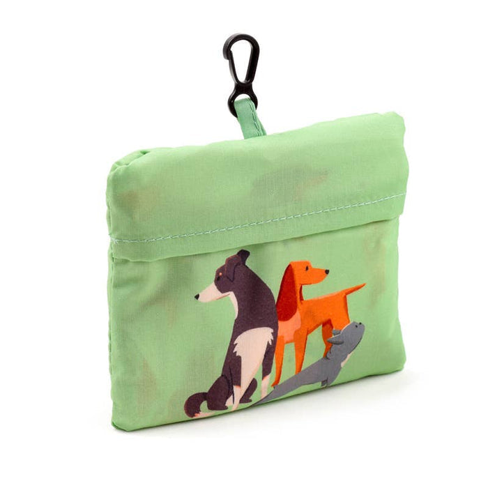 Green pouch with totebag inside with dog illustrations and a carabiner clip on a white background