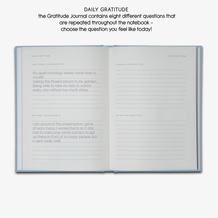 Two pages in Gratitude journal with guided texts 'DAILY GRATITUDE', 'THREE THINGS I AM GRATEFUL FOR', 'ONE THING I CAN BE PROUD OF', 'A PERSON I AM GRATEFUL FOR' AND 'THE BEST PART ABOUT TODAY'.
