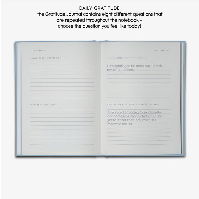 Two pages in Gratitude journal with guided texts 'DAILY GRATITUDE', 'A REASON TO BE EXCITED FOR THE FUTURE', 'AN ACT OF KIDNESS I RECEIVED', 'A VALUABLE LESSON I LEARNED OR AM LEARNING' AND 'HOW CAN I SHOW MY GRATITUDE TO THE PEOPLE I CARE ABOUT'.