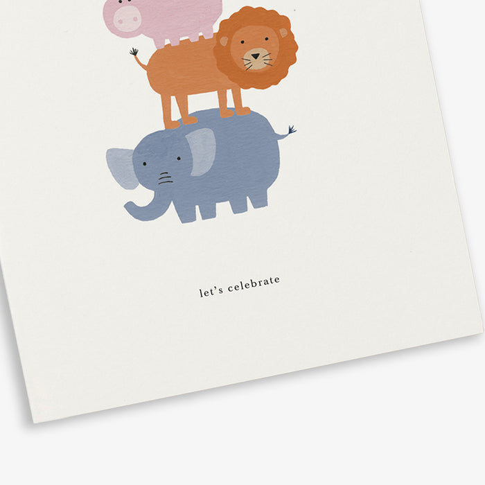 A greeting card with a illustration of an animal tower (consisting of a bird, a pig, a lion and an elephant) and the text 'let's celebrate'.