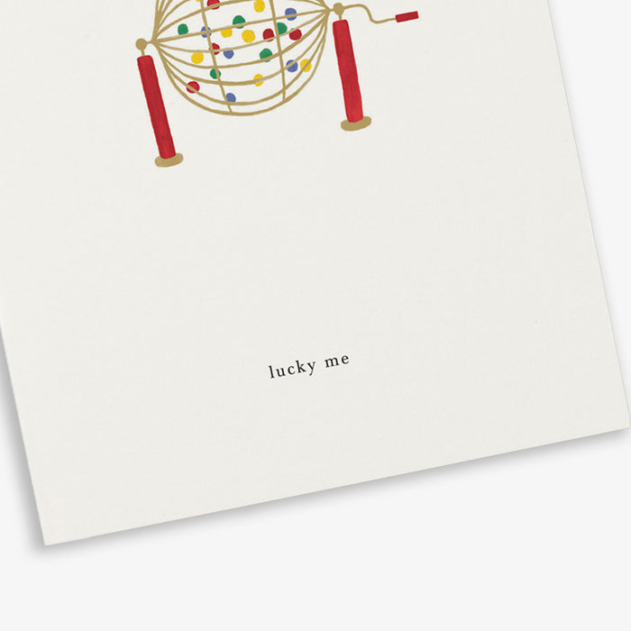 A greeting card with a bingo pattern design and the text 'Lucky me.'