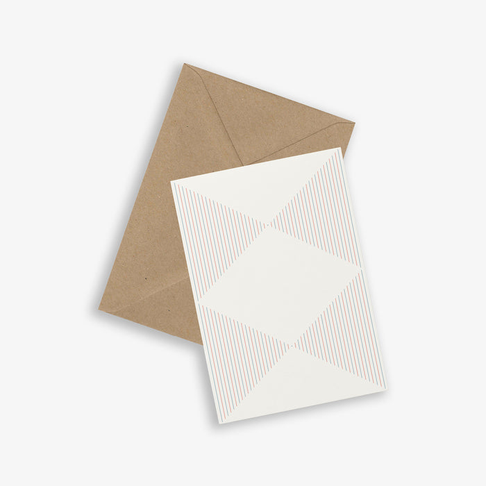 A white greeting card with a pattern of red and blue stripes forming a butterfly motif, accompanied by a brown kraft envelope.