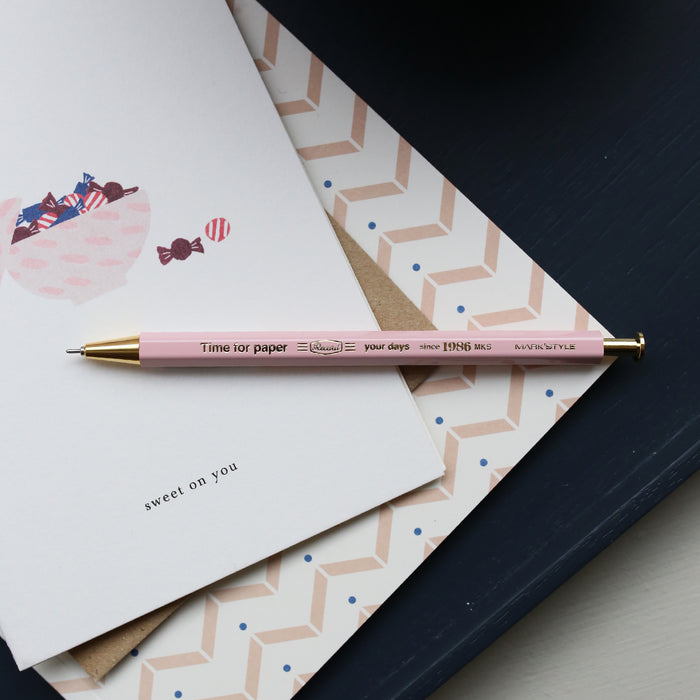 Greeting card with a candy bowl and the text 'sweet on you' and a pink pen.