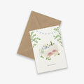 Greeting card with illustration of a party scene and envelope on a white background. with the text 'time to celebrate'