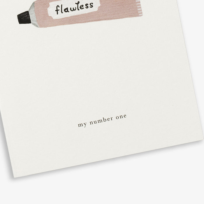 A simple, illustrated greeting card with a 'flawless' cream and the text 'my number one' on it. The card is placed against a white background.