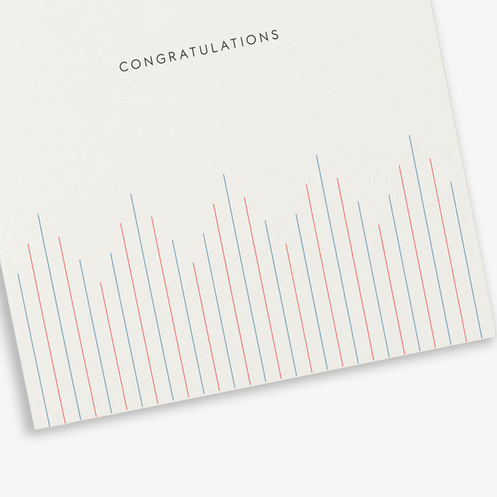 A simple, illustrated greeting card with the text 'Congratulations' printed in the center. The card features a striped pattern in shades of red and blue.