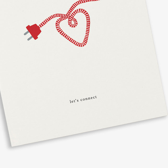 A white greeting card with a red heart and cord illustration with the text 'let's connect'.