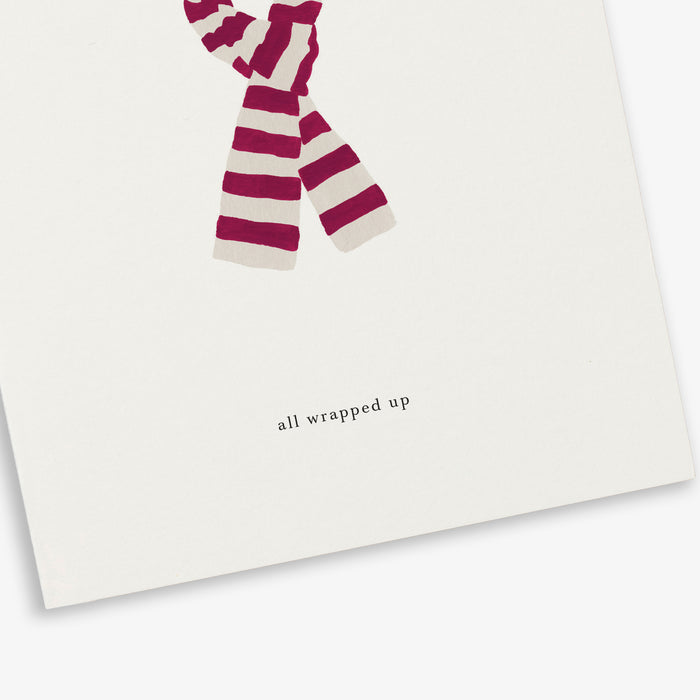A simple illustrated greeting card with a scarf design with the text 'all wrapped up'.