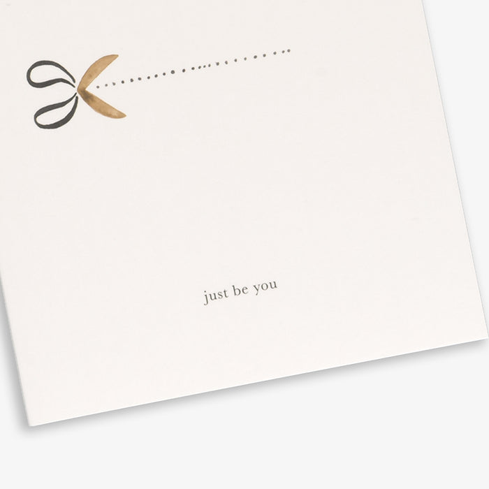 A simple illustrated greeting card with two scissors and the text 'just be you'.