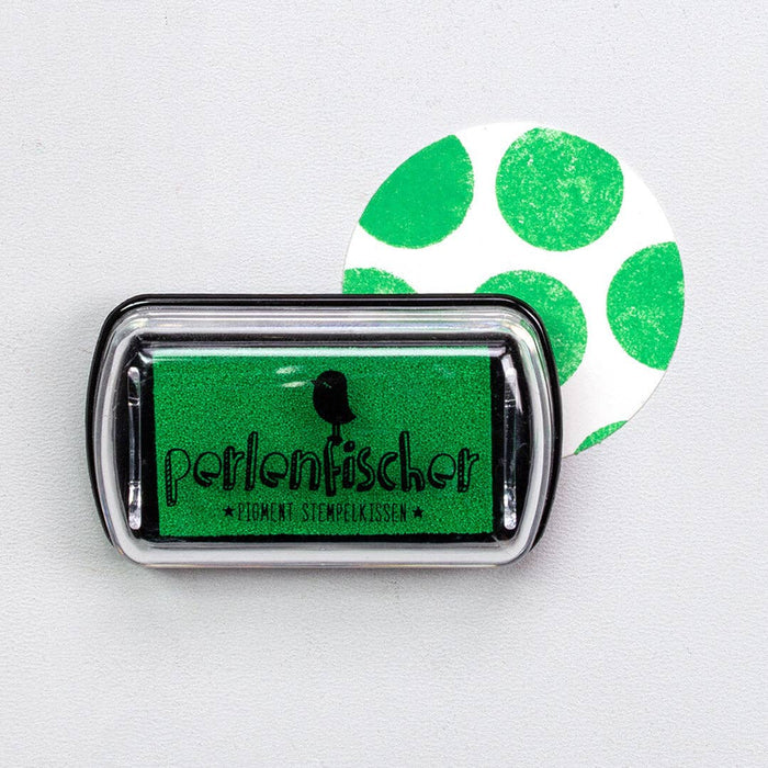 Green ink pad with 'Perlenfischer' branding on a white background