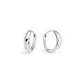A pair of silver huggie earrings made of surgical stainless steel