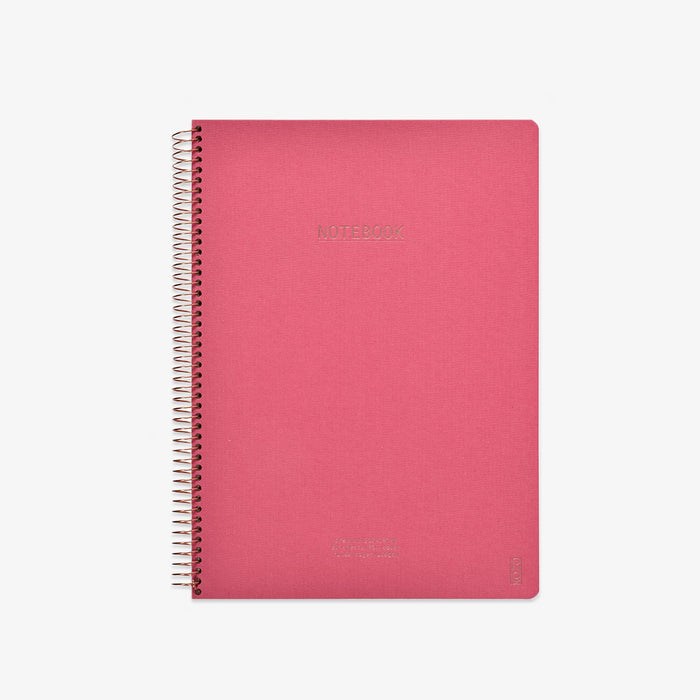 Pink notebook with spiral binding on a white background