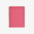 Pink notebook with spiral binding on a white background