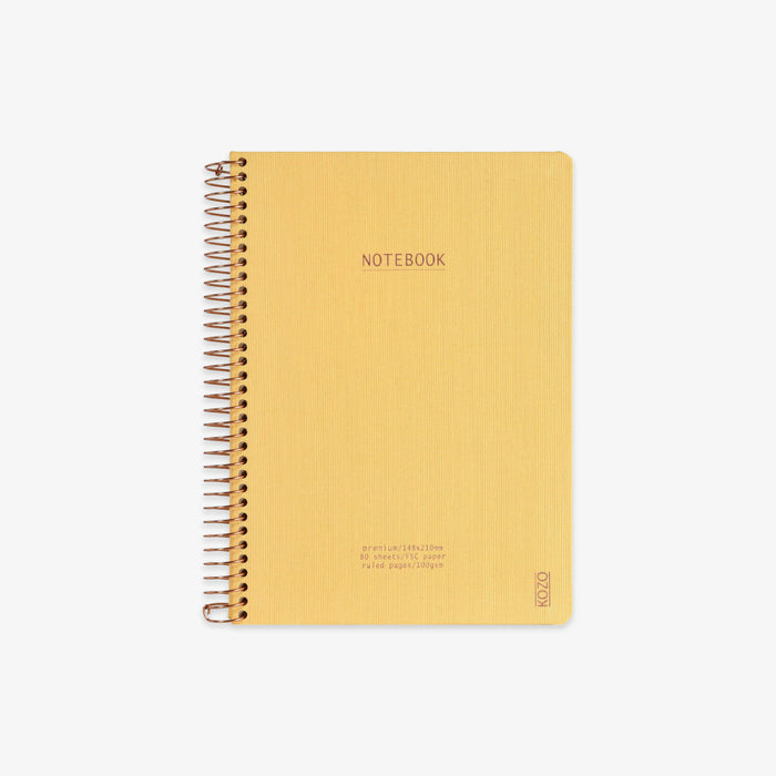 Yellow notebook with spiral binding on a white background