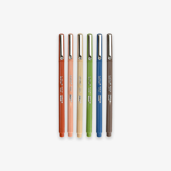 Set of five pens in different colors on a white background