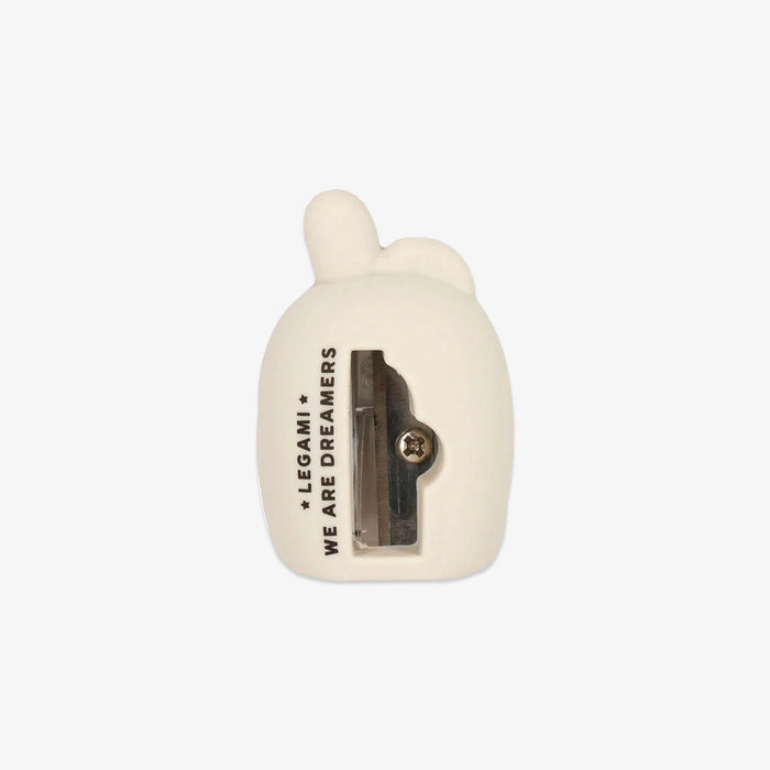 White pencil sharpener with 'We Are Dreamers' text on a white background