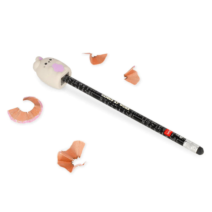 pencil sharpener designed like a bunny, pen and sharpened shavings on a white background