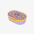 A purple oval lunch box with a yellow handle and a clear lid decorated with a daisy pattern and the words 'Enjoy the little things'.