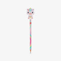 A pastel-colored pencil with a cute cartoon unicorn squishy character on top, set against a plain light gray background.