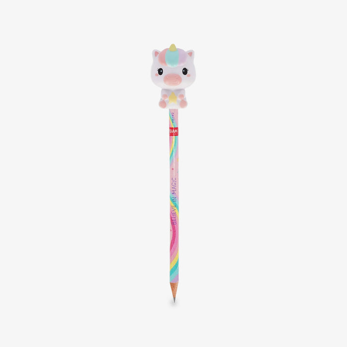 A pastel-colored pencil with a cute cartoon unicorn squishy character on top, set against a plain light gray background.