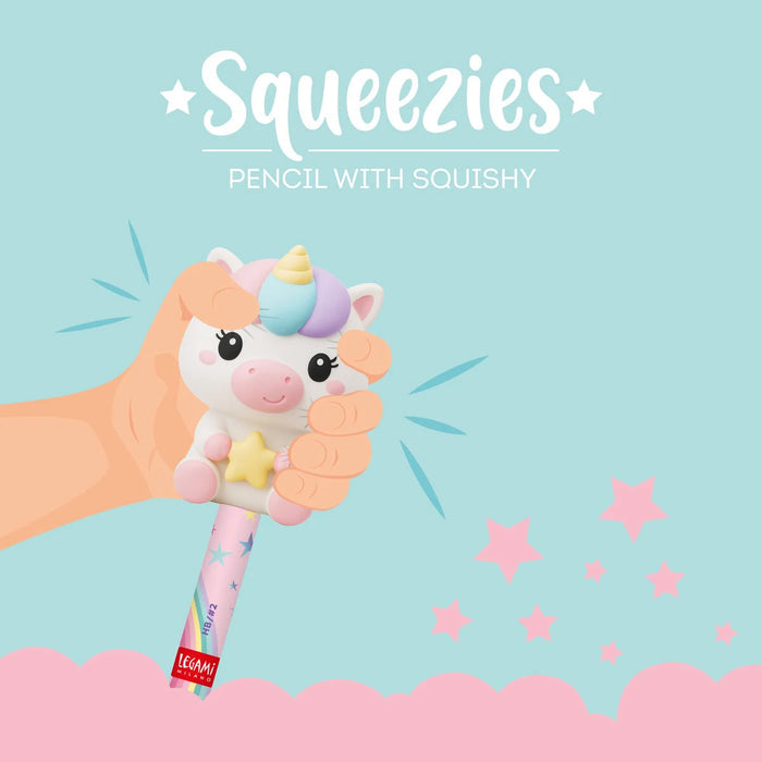 Unicorn-shaped pencil with squishy texture held by a hand on a light blue background with stars.