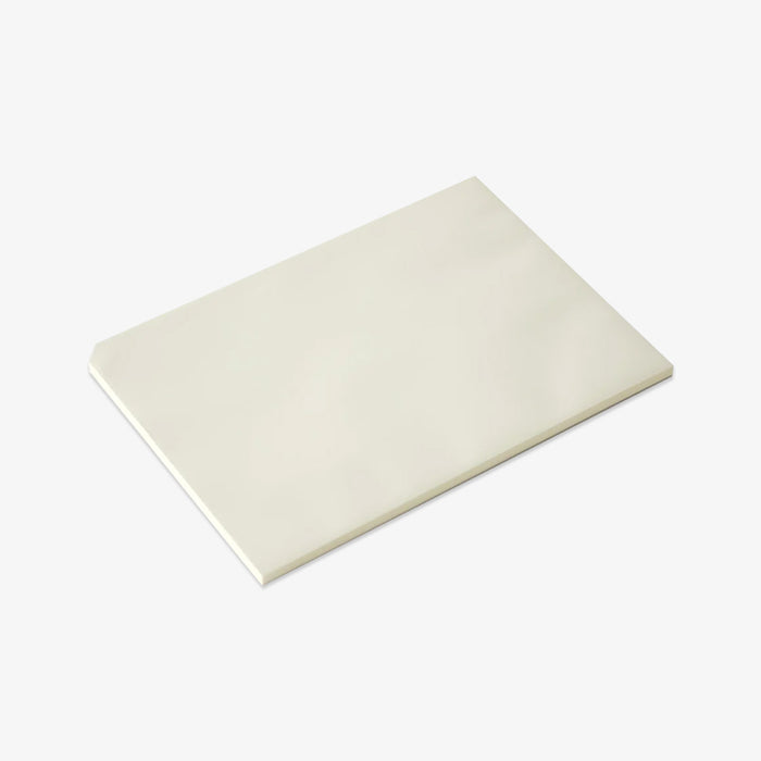 White notepad on a light gray background