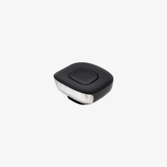 Black and silver LED book light on a white background