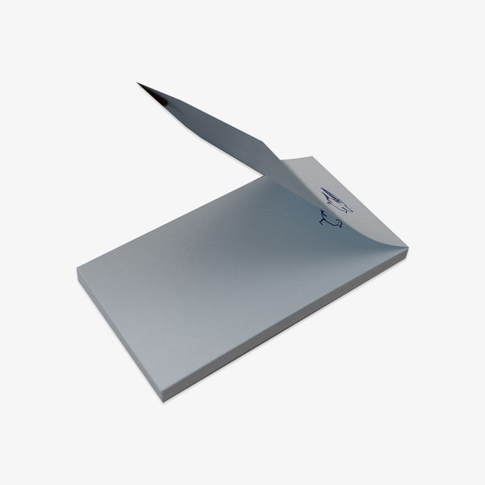 Light blue notepad with a blue logo on a white background