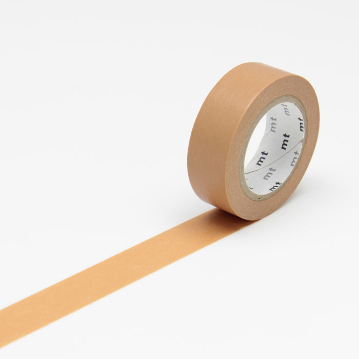 A roll of beige MT masking tape unrolled to show the solid color tape with a paper backing.