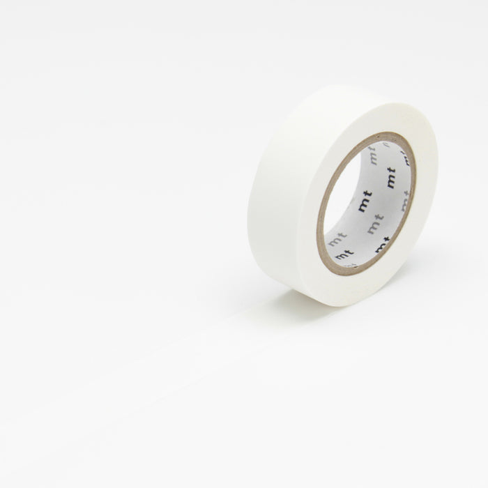 A roll of matte white masking tape with the MT brand visible on the tape core.