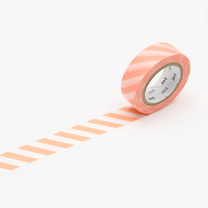 A roll of MT masking tape with a pattern of stripes in varying shades of white and orange, unrolled slightly to show the pattern.