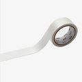 Roll of silky white masking tape with a brand label on a white background