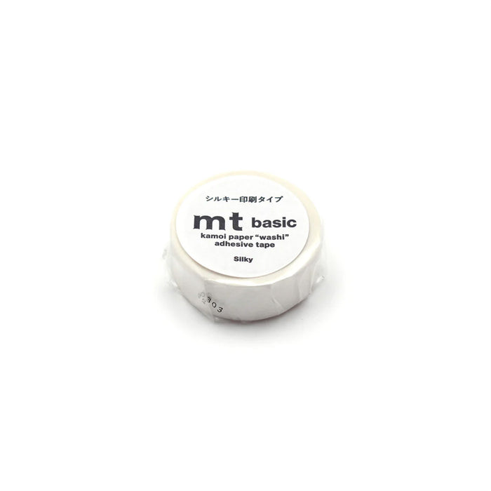Roll of silky white mt basic adhesive tape on a white background