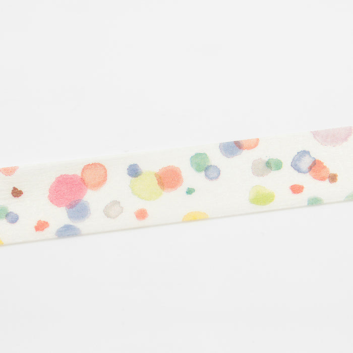 A roll of MT masking tape with a multicolored dot pattern on a beige background.