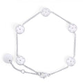 Silver chain bracelet with five round mother-of-pearl flower charms on a white background. Waterproof, stainless steel and allergy free. By Mia Bijoux Canada.

Bracelet à maillons argenté orné de cinq pastilles rondes à fleur en nacre sur fond blanc. Résistant à l'eau, en acier inoxydable et hypoallergénique. Par Mia Bijoux Canada.