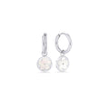 Silver hoop earrings with a round pendant featuring a mother-of-pearl flower on a white background. Nickel-free, waterproof & tarnish-resistant stainless steel earrings for sensitive skin, minimalist luxury jewelry by Mia Bijoux Canada.

Boucles d'oreilles anneaux argentées avec pendentif rond orné d'une fleur en nacre sur fond blanc. Boucles d'oreilles en acier inoxydable sans nickel, résistantes à l'eau et anti-ternissement pour peaux sensibles, bijouterie de luxe minimaliste par Mia Bijoux Canada.