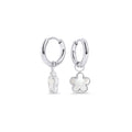 Silver stainless steel hoop earrings with dangling white flower charms, hypoallergenic and tarnish-free, designed for sensitive ears. Lightweight everyday jewelry, water-resistant, perfect for modern women in Canada and Toronto seeking durable, stylish hoops.