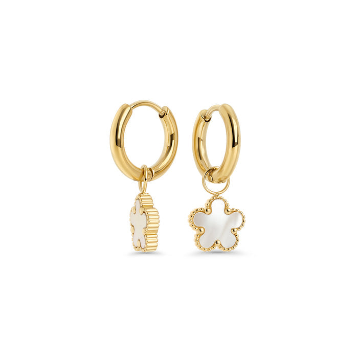 Gold stainless steel hoop earrings with white flower drop charms, hypoallergenic and tarnish-resistant, safe for sensitive skin. Lightweight everyday earrings, water-friendly and durable.
